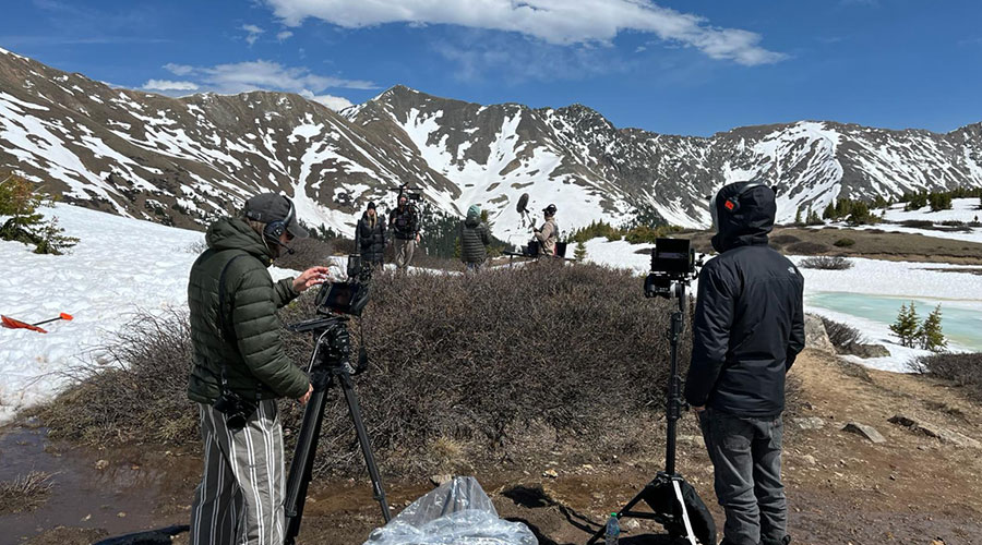 Film crew filming in a snowy landscape