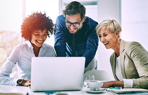 Business people sitting at the table attending E-learning Courses