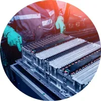 Image of a person working on batteries of an electric vehicle.