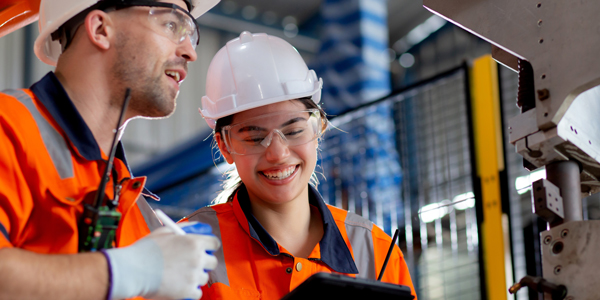 two young engineers in facility