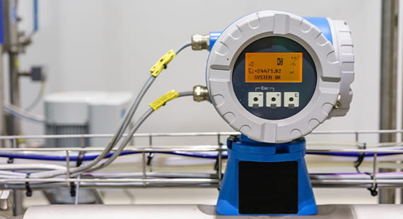 Evaluation of a comparison between PTB and TÜV SÜD National Engineering Laboratory in water flow rates